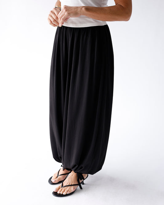 black balloon pants with hem tie detail and elastic waistband