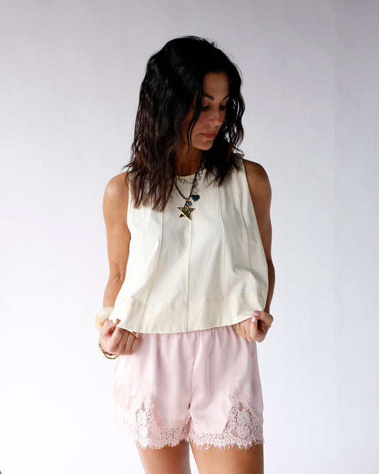 white sleeveless tank top with contrast stitching detailing white flowy structured tank top