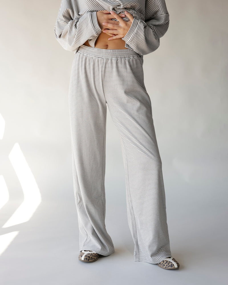 Gray and white striped wide-leg lounge pants with elastic waistband