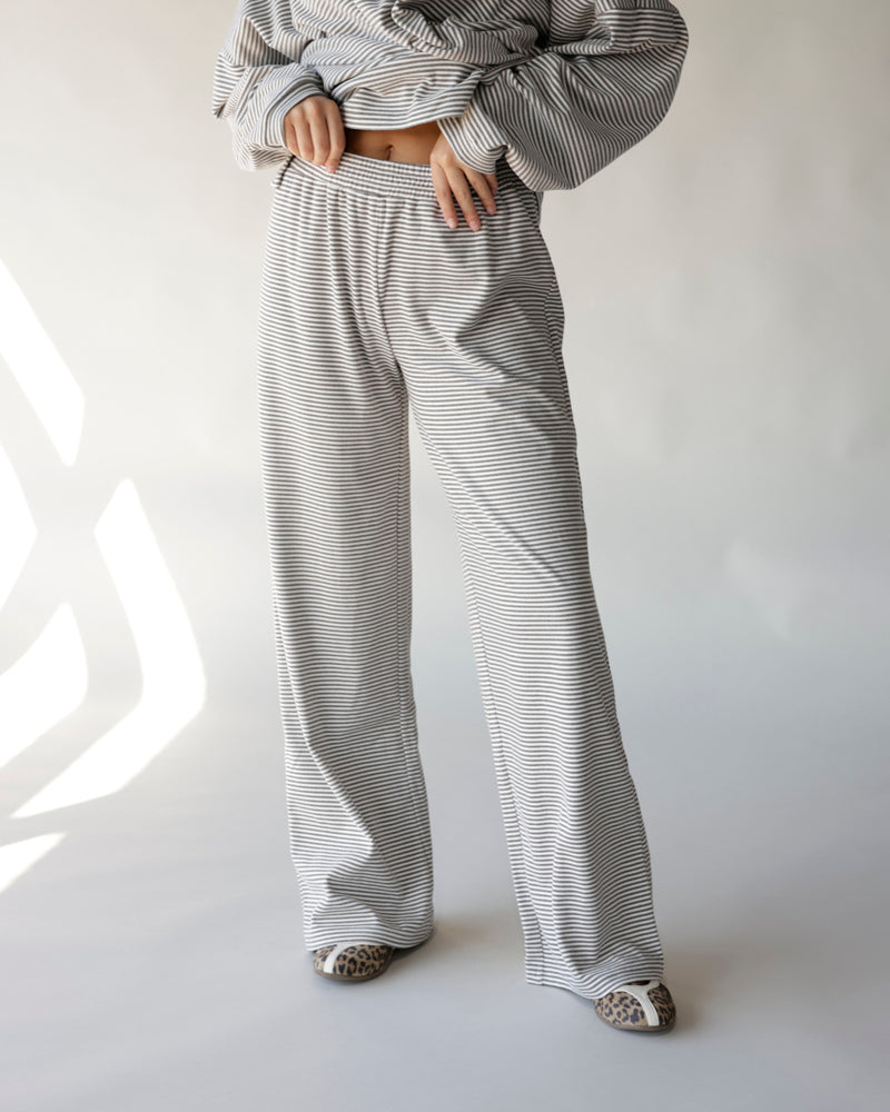 Gray and white striped wide-leg lounge pants with elastic waistband
