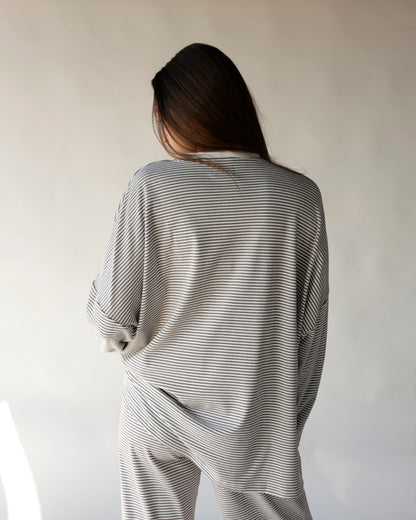 Gray and white striped lounge pants and matching top, rear view