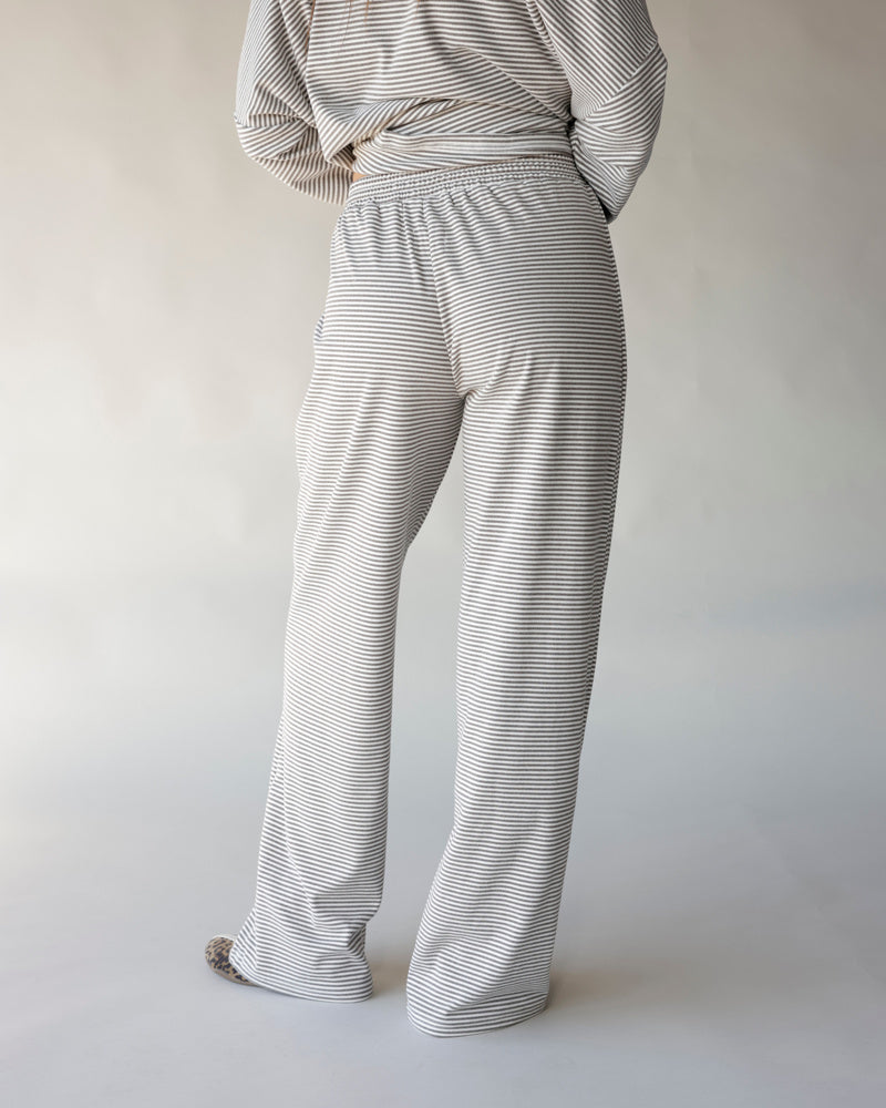 Gray and white striped wide-leg lounge pants with elastic waistband, back view