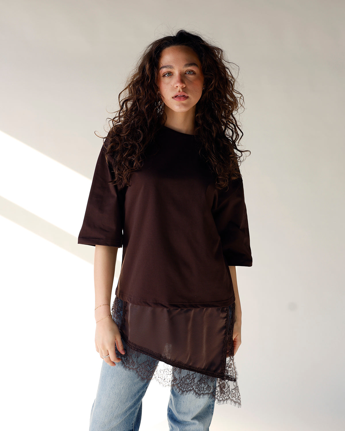 brown short sleeve tee with asymmetrical lace hem detail