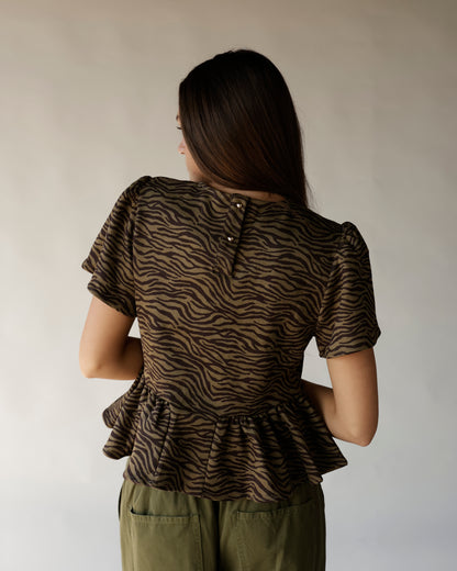 Brown and black zebra print peplum top with short sleeves, back view