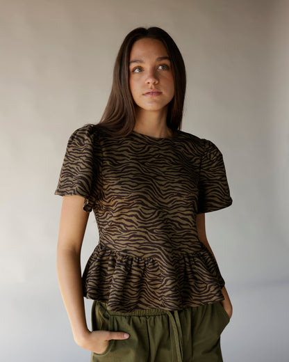 Brown and black zebra print peplum top with short puff sleeves and ruffle hem