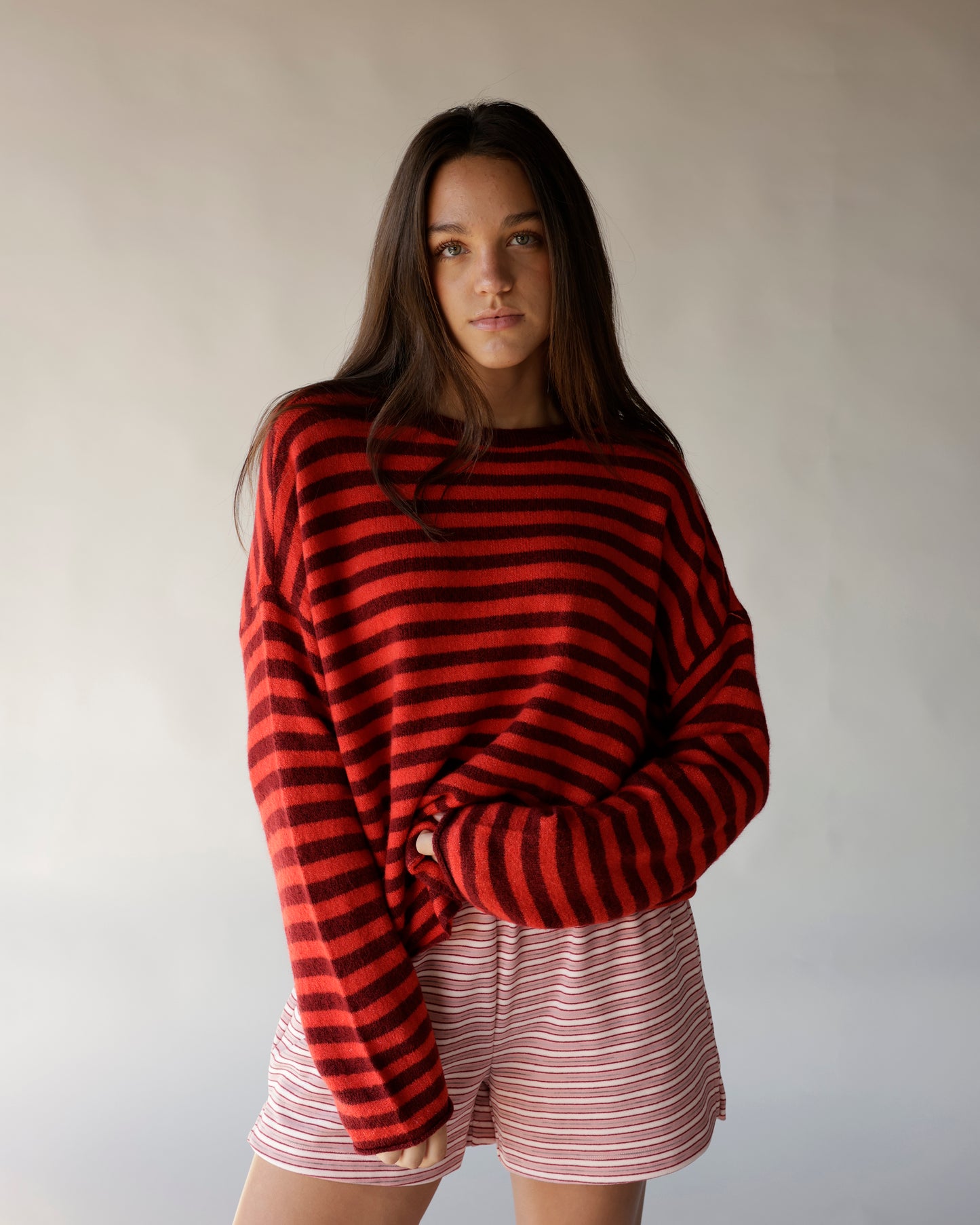 Red and burgundy striped oversized mock neck sweater with long sleeves