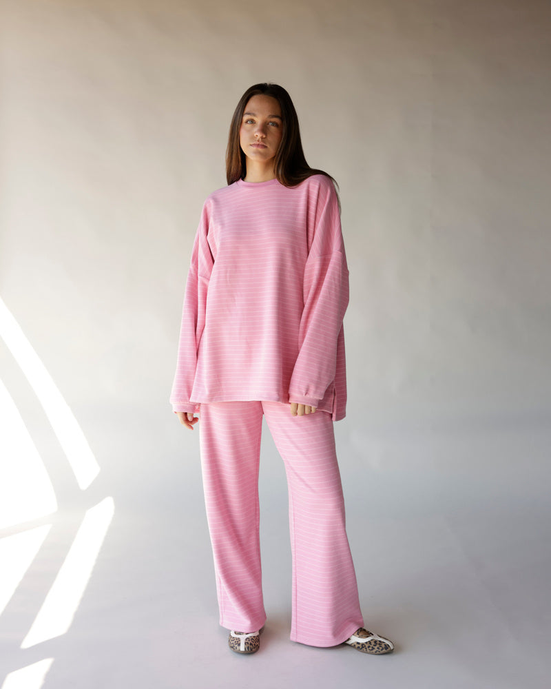 Oversized pink striped long sleeve tee paired with matching wide-leg pants