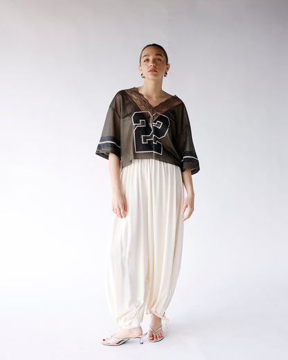 cream balloon pants with hem tie detail and elastic waistband