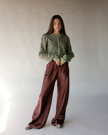 Striped green and brown zip-up knit hoodie with long sleeves and ribbed cuffs