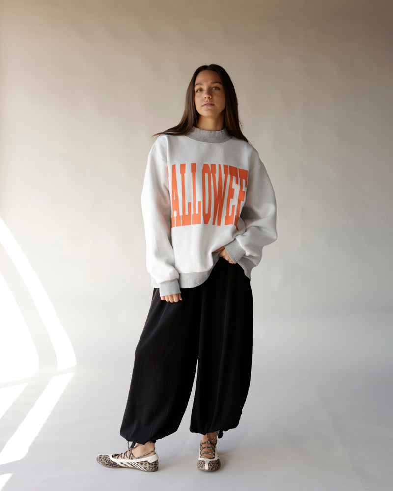 Gray oversized Halloween mock neck sweatshirt with bold orange graphic lettering