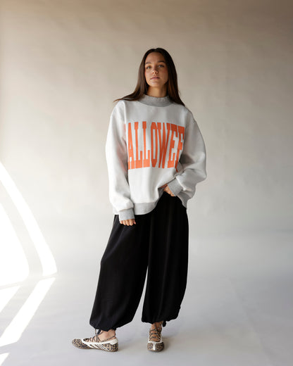 Gray oversized Halloween mock neck sweatshirt with bold orange graphic lettering