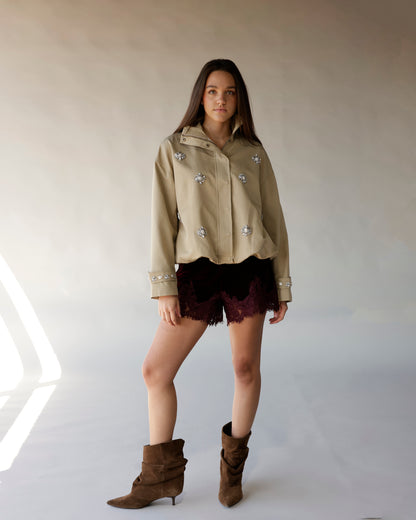 Maroon velvet shorts with lace scalloped hem, worn with khaki jacket and brown boots