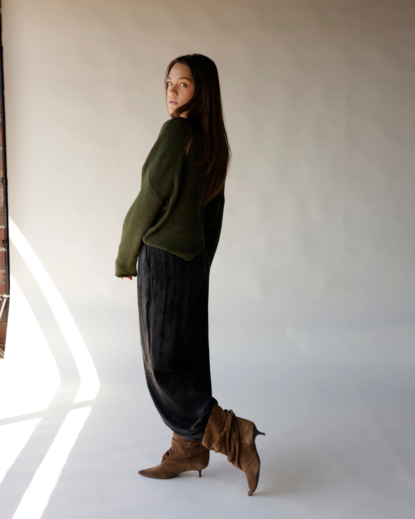 Dark olive green mini mock neck sweater with relaxed fit and long sleeves