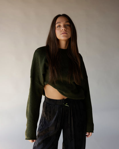 Dark olive green cropped mock neck knit sweater with long sleeves and open hem