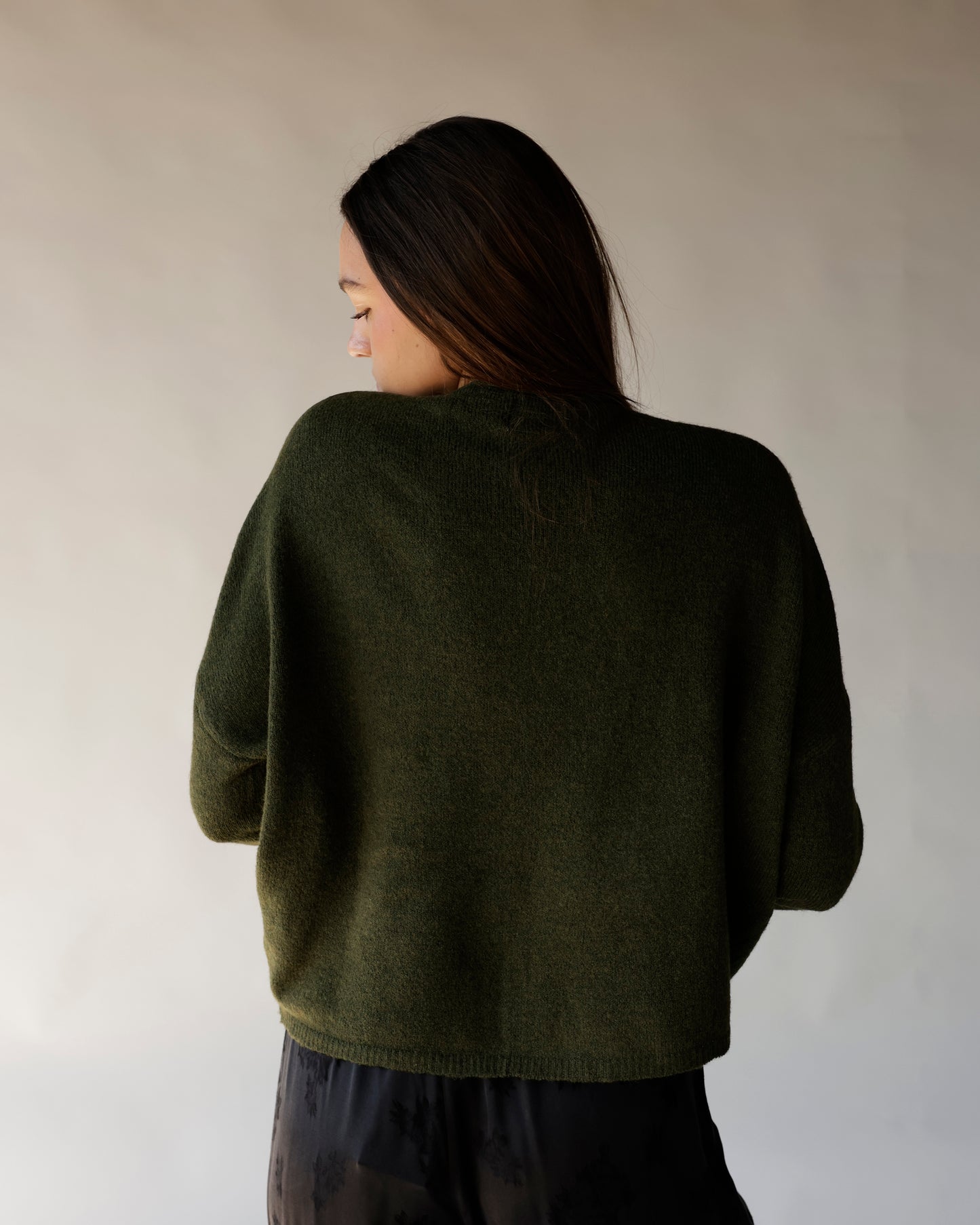 Dark olive green cropped mock neck knit sweater, back view, relaxed fit
