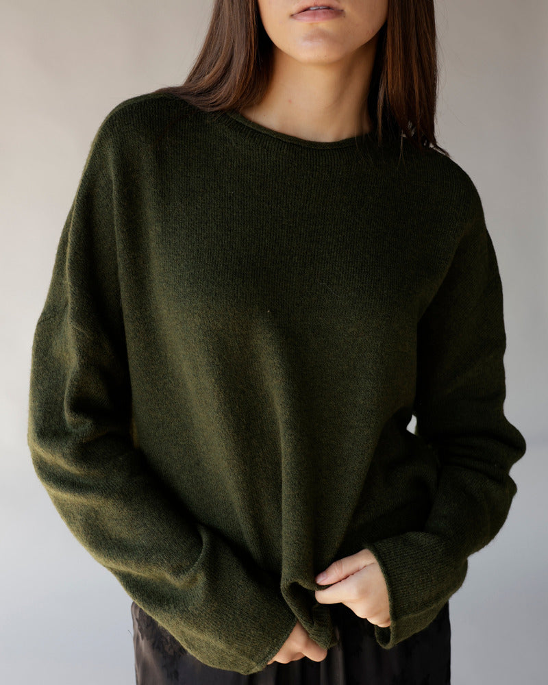 Dark olive green oversized crew neck knit sweater with ribbed cuffs and hem