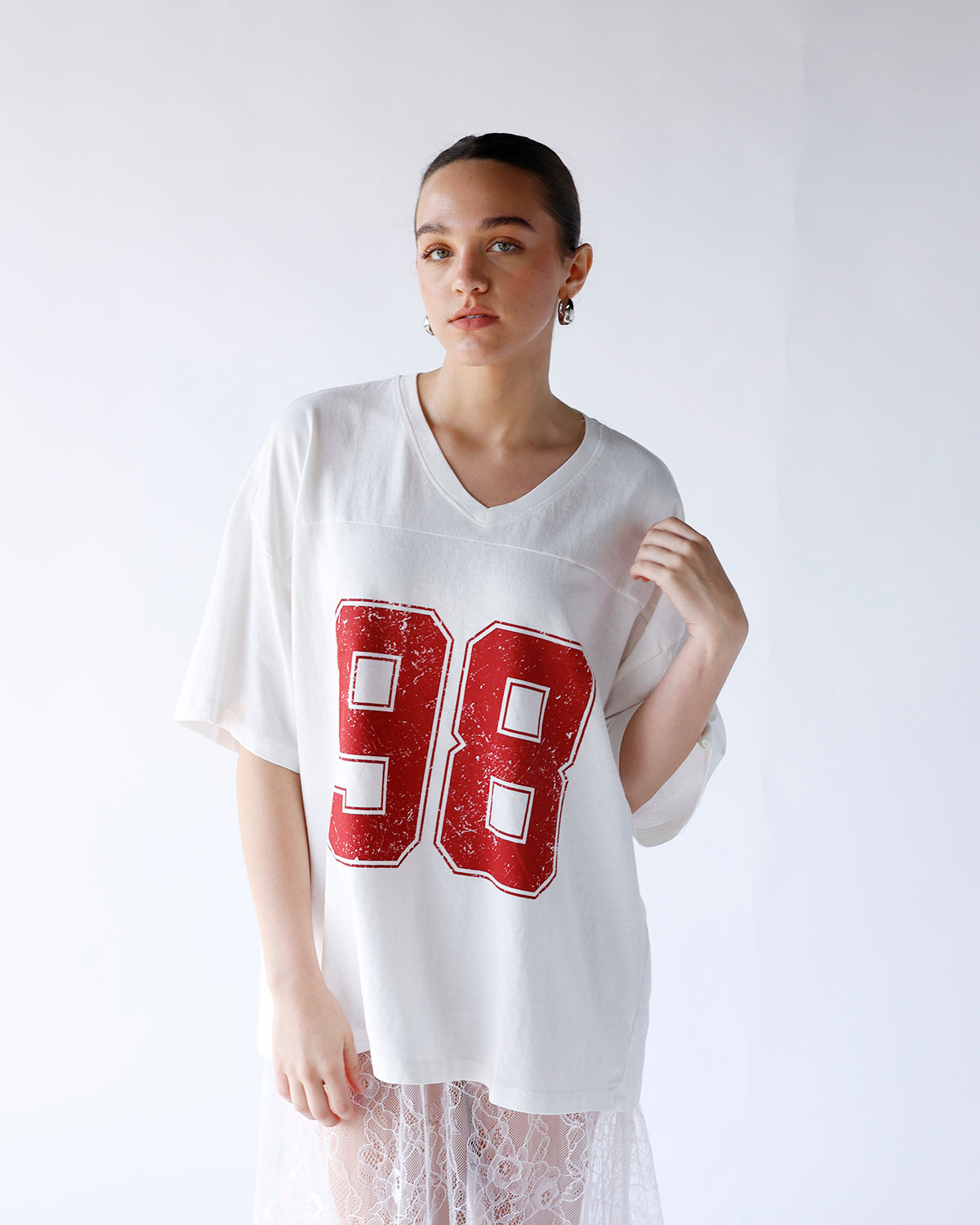 white v-neck varsity short sleeve tee with red "98" graphic on front chest
