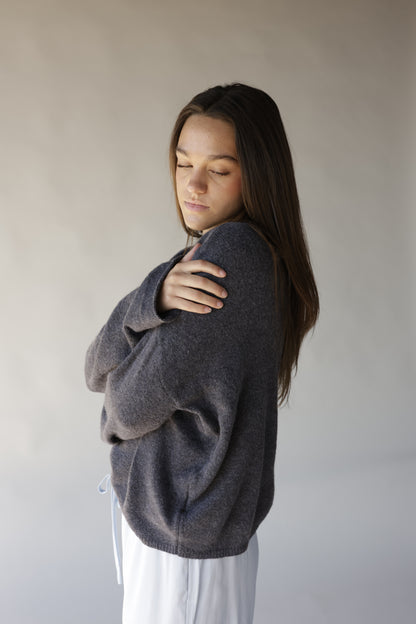 Dark gray mini mock neck sweater with relaxed fit and ribbed hem