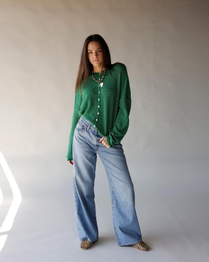 Green and white striped button-front cardigan with ribbed knit texture and long sleeves