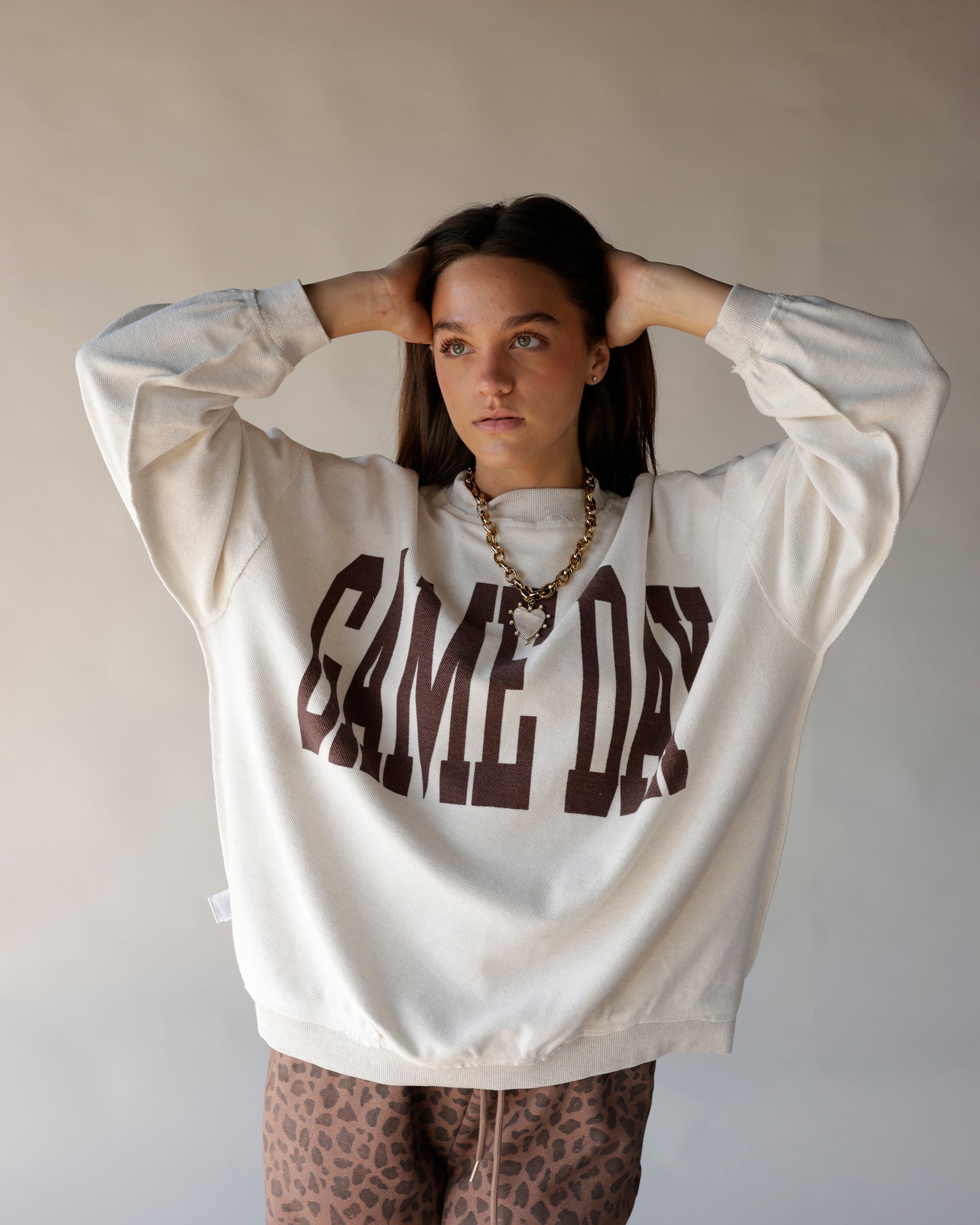 Cream oversized Game Day reversible mock neck sweatshirt with brown varsity lettering