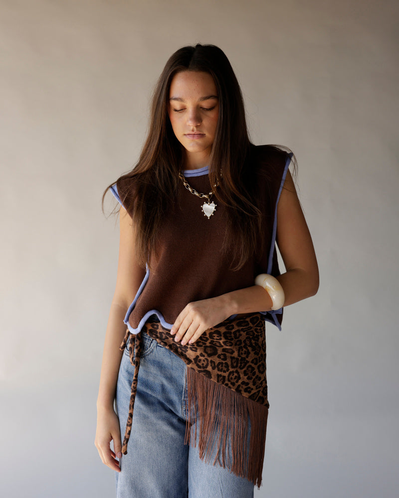 Brown sleeveless knit vest with lavender trim and leopard fringe scarf