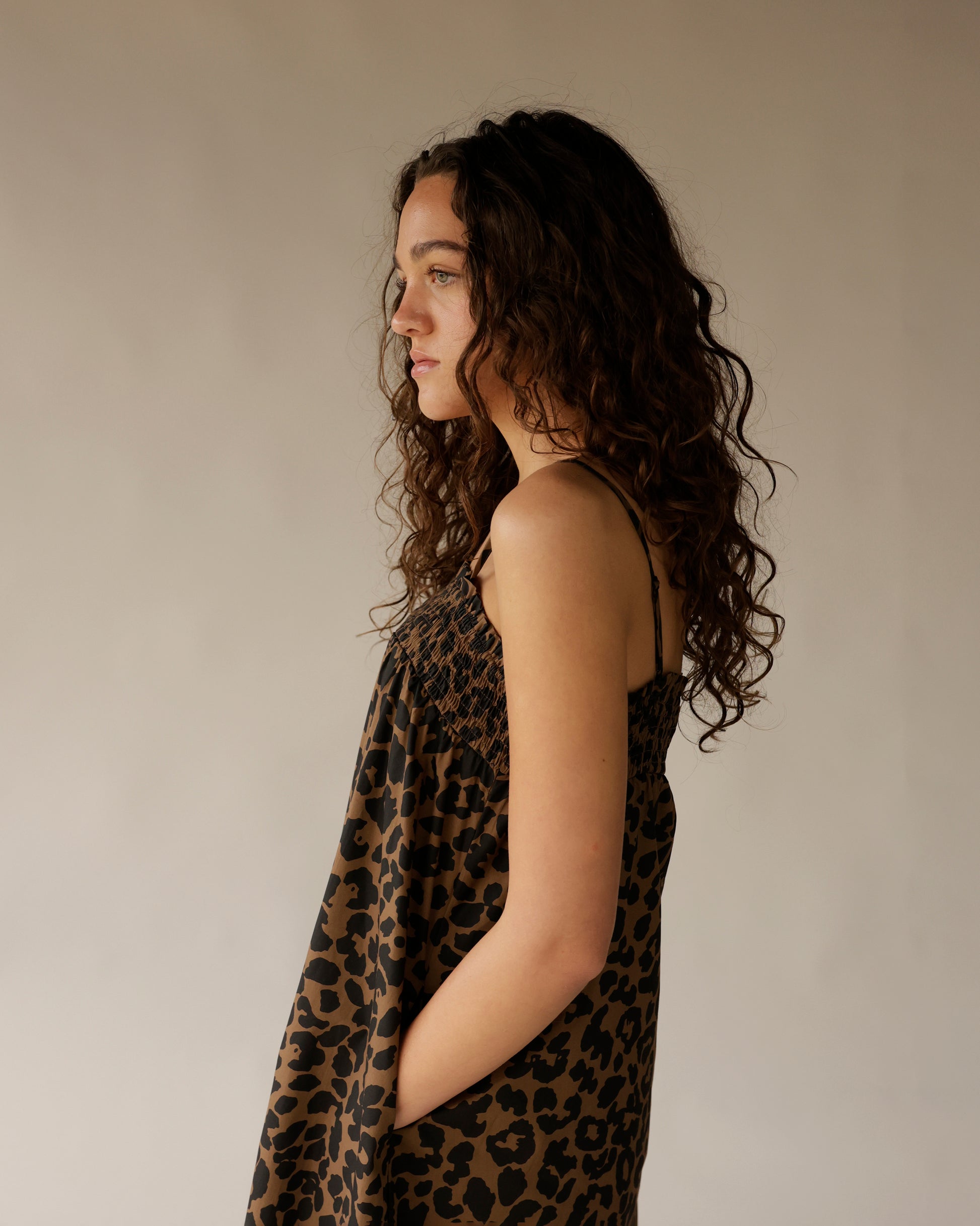 Leopard print maxi dress with smocked bodice and thin straps, side view