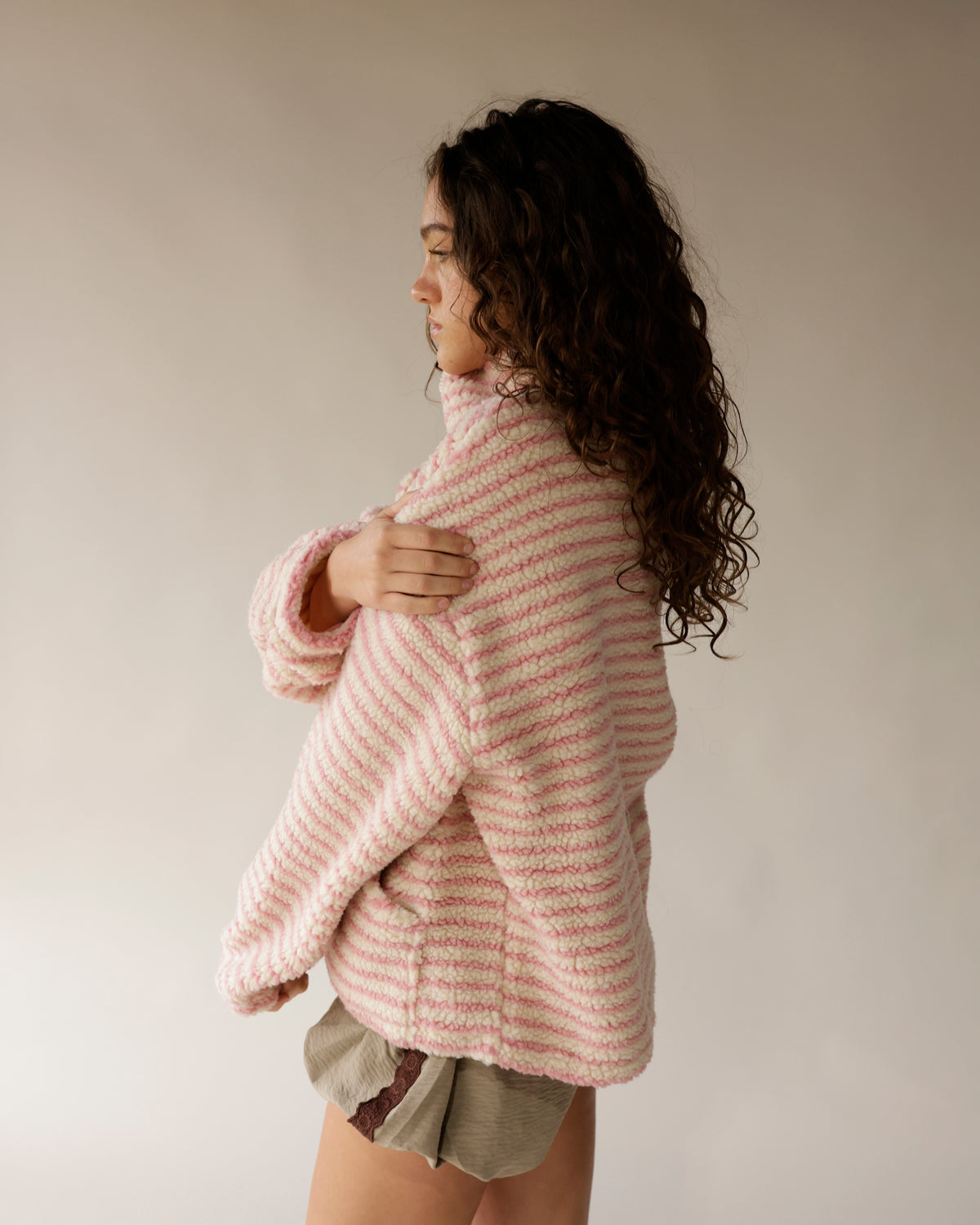 Pink striped sherpa turtleneck pullover with cozy oversized fit and textured fleece
