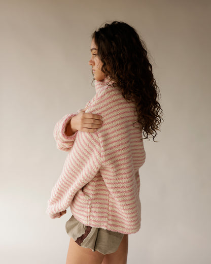 Pink striped sherpa turtleneck pullover with cozy oversized fit and textured fleece