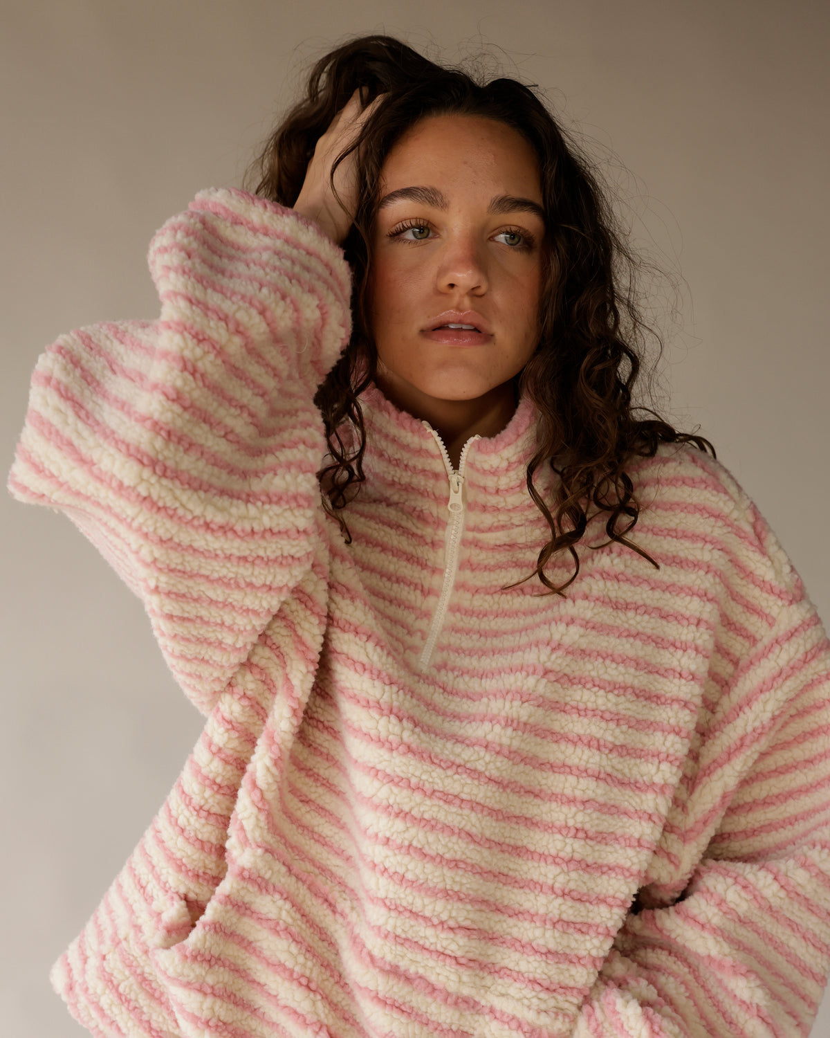 Pink and cream striped sherpa quarter-zip pullover, oversized fit with fleece texture