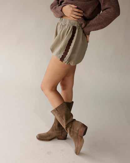 Mocha brown cropped knit sweater styled with sage mini skirt and tan suede boots