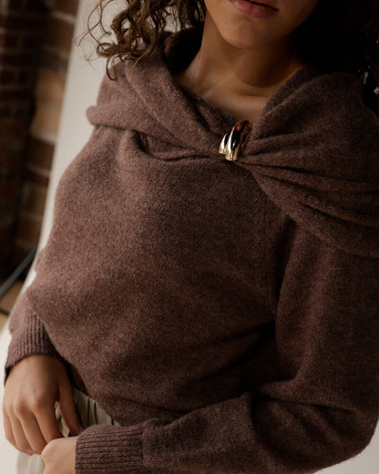 Mocha brown knit sweater with draped neckline secured by gold ring clasp