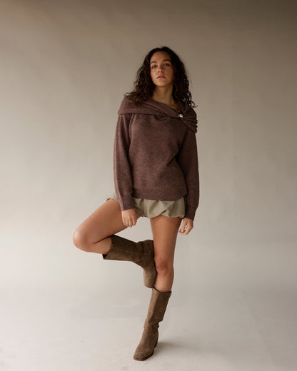 Mocha brown off-shoulder knit sweater with wrap neckline and gold pin detail