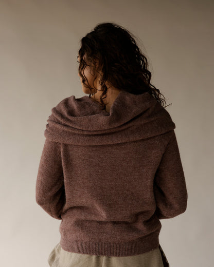 Mocha brown cowl neck knit sweater shown from the back on a model