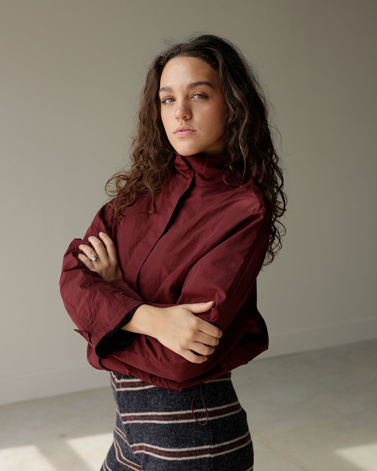 dusty burgundy mimosa women's jacket featuring a stand collar, front zipper, relaxed silhouette and subtle crinkled texture.
