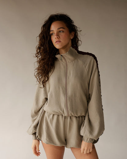 Women's taupe elastic-waist shorts paired with matching zip-up jacket, casual loungewear set