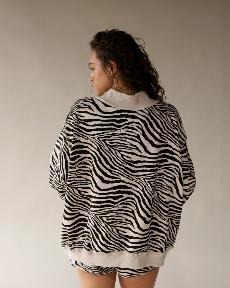 Oversized zebra print mock neck sweatshirt in black and white, back view