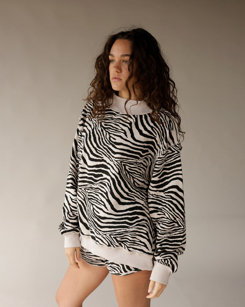 Oversized zebra print reversible mock neck sweatshirt in black and white
