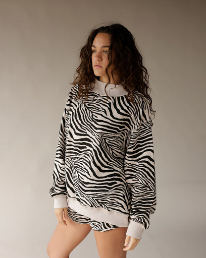 Oversized zebra print reversible mock neck sweatshirt in black and white