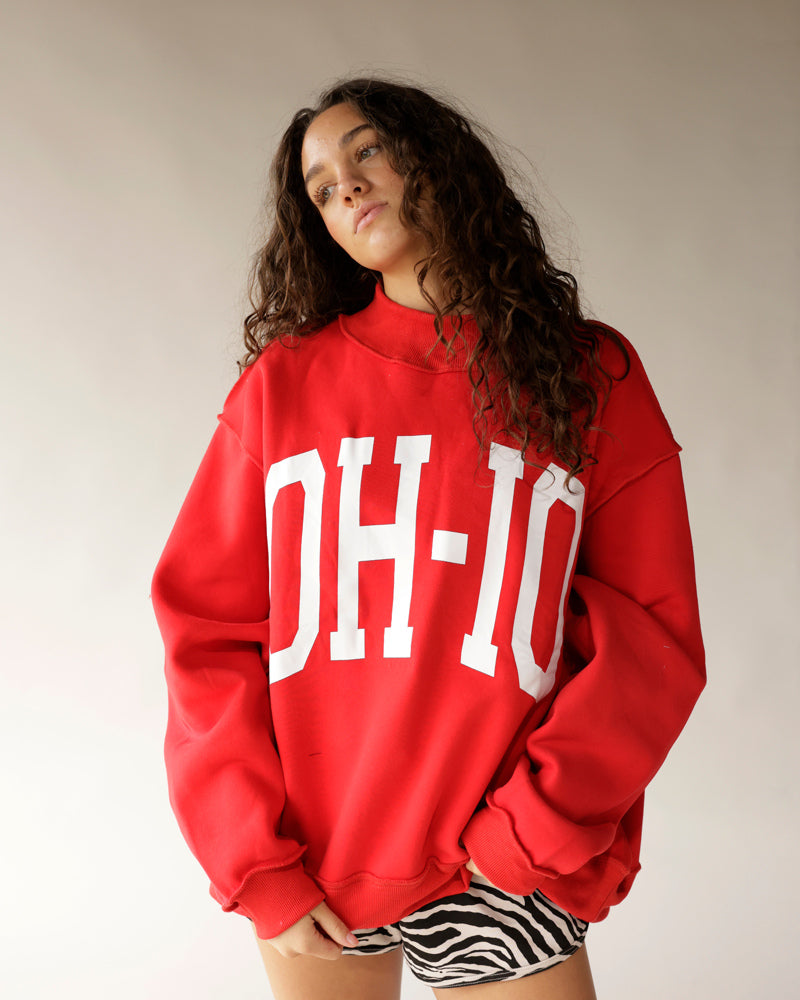 Oversized red mock neck sweatshirt with bold white OH-IO graphic print