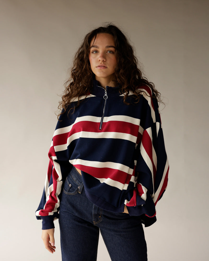 Navy, red, and white stripe quarter-zip pullover sweatshirt with ring zipper pull