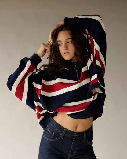 Navy, red, and white striped quarter-zip cropped pullover with wide sleeves