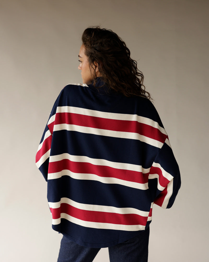 Navy, red, and white striped oversized quarter zip pullover, back view