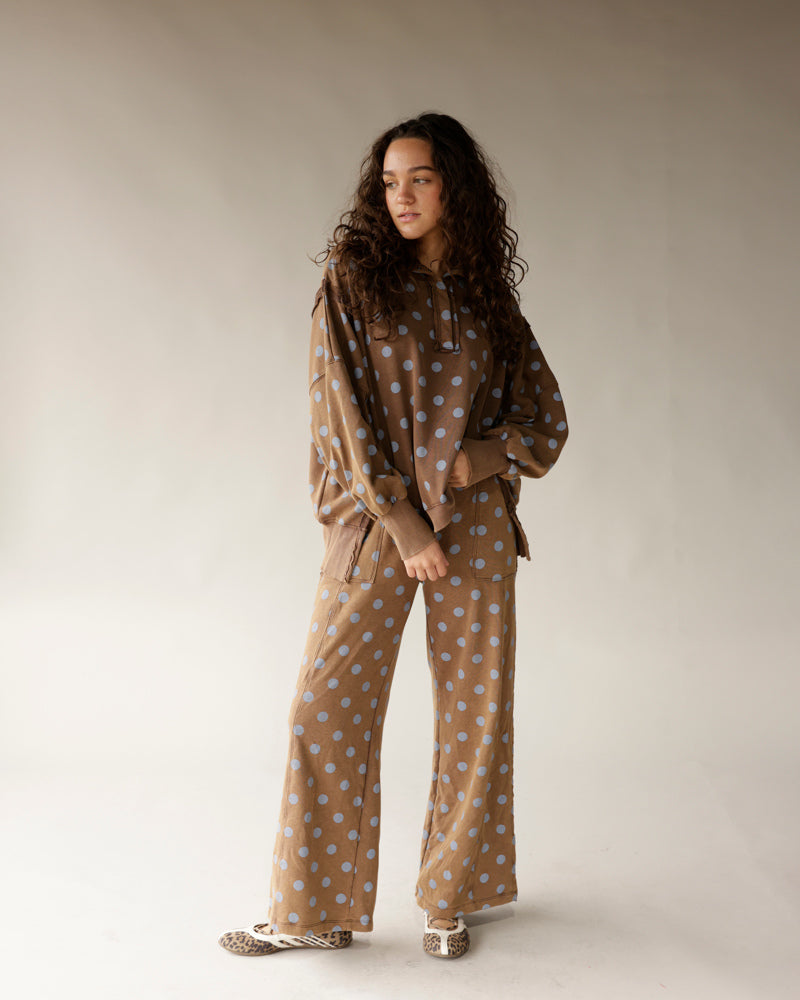 Mocha brown wide-leg lounge pants with blue polka dot pattern, relaxed fit