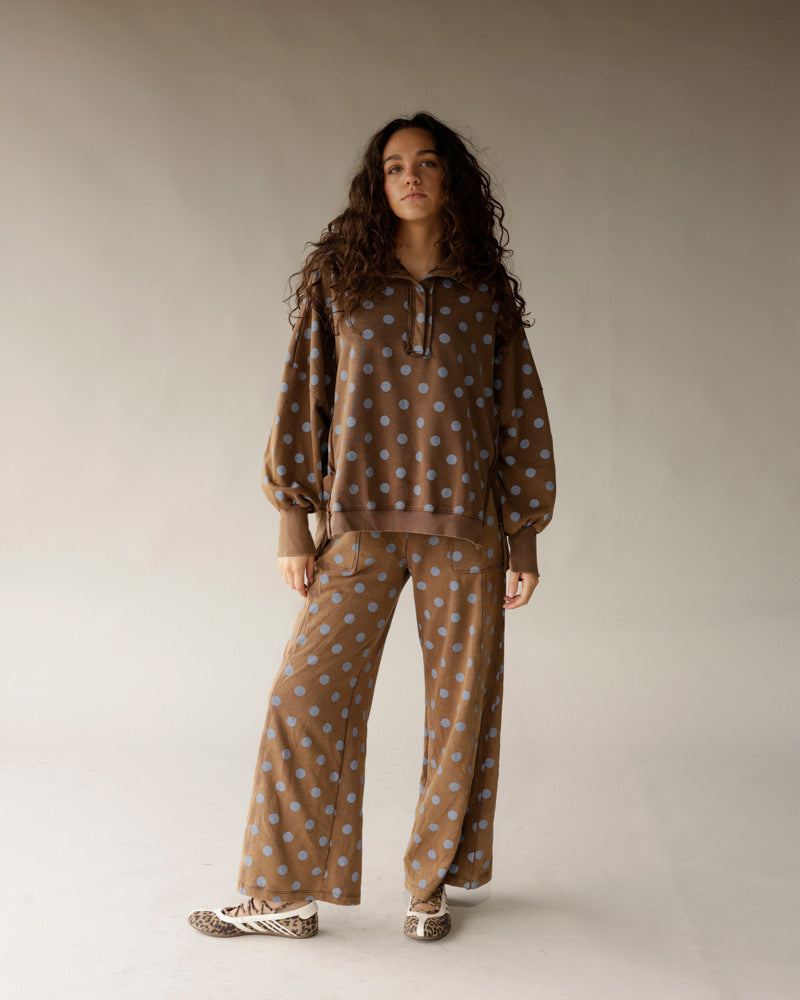 Mocha brown wide-leg lounge pants with blue polka dot print, relaxed fit