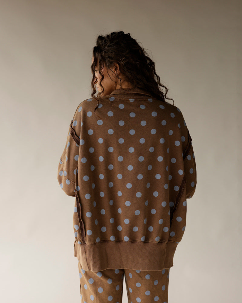 Brown polka dot lounge set with blue dots, shown from back on model