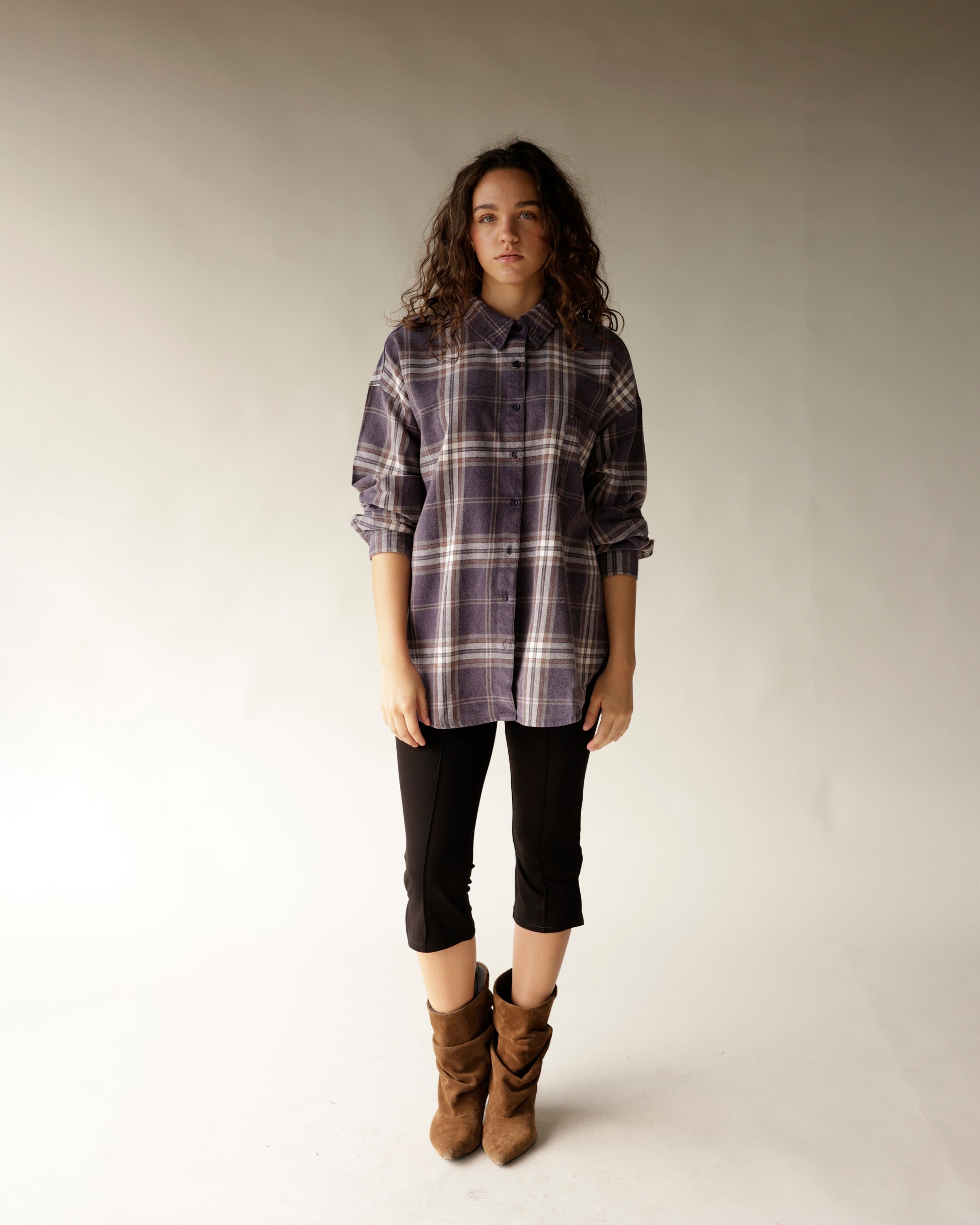 Oversized navy plaid flannel button-up shirt with dark buttons and collar