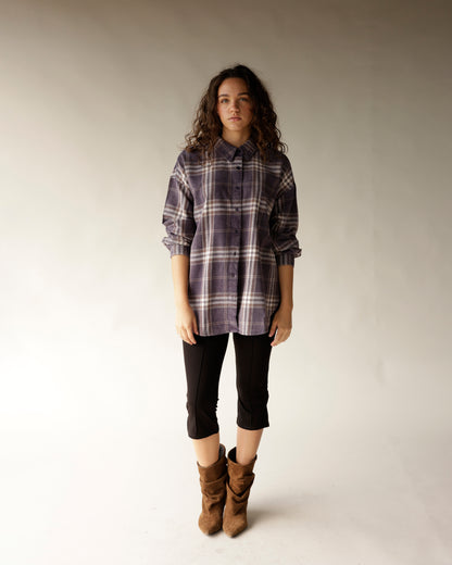 Oversized navy plaid flannel button-up shirt with dark buttons and collar
