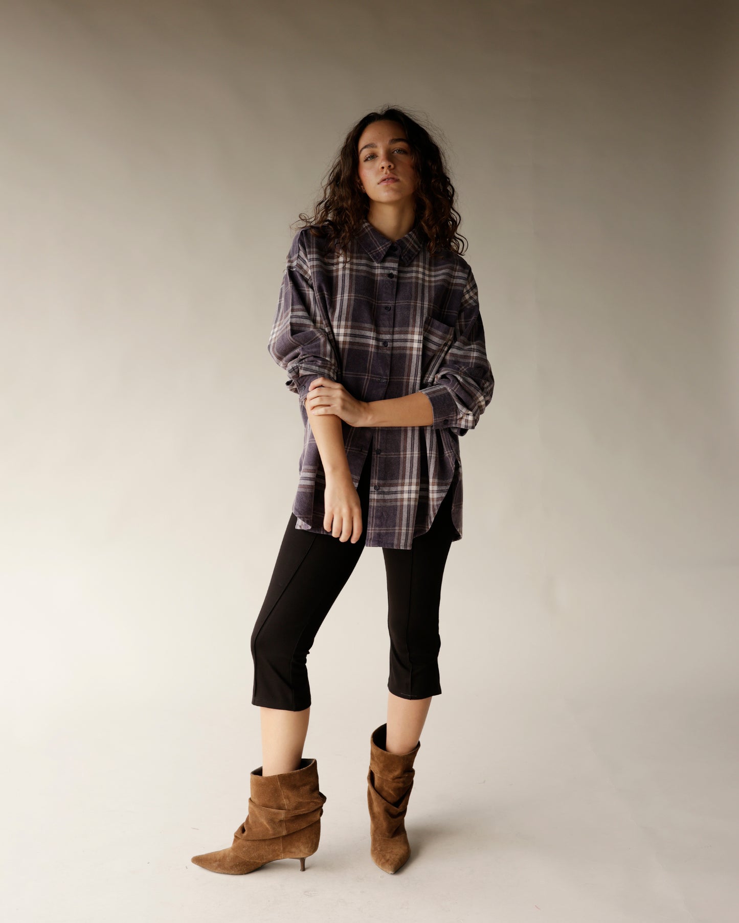 Oversized navy plaid flannel button-up shirt with chest pockets and snap buttons