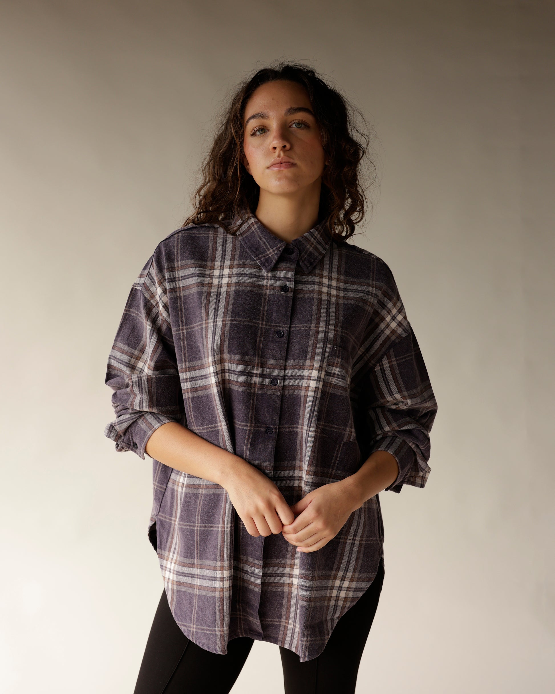 Oversized navy plaid flannel button-up shirt with collar and rolled sleeves