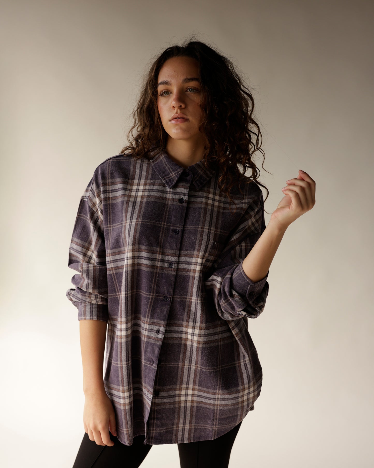 Oversized navy plaid flannel button-up shirt with brown and white checks, rolled cuffs